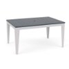 Three-quarter perspective view of a 42x60-inch rectangular MGP outdoor dining-height table featuring a navy blue slatted top with a centered umbrella hole, resting on a white frame with tapered legs.