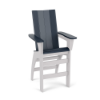 Three-quarter perspective view of a bar-height MGP outdoor chair featuring navy blue top slats, seat, and armrests paired with a contrasting solid white frame and integrated footrest bars.