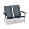 Three-quarter perspective view of a two-seat modern outdoor MGP Adirondack loveseat, featuring navy blue back panels, slatted seat, and wide armrests supported by a contrasting solid white frame.