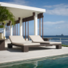 A commercial double outdoor chaise lounge with a dark brown woven wicker frame and beige cushions positioned poolside on a white tile deck overlooking the ocean under a clear blue sky.