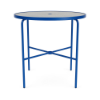 Perspective view of a 42-inch round Sundance commercial outdoor bar table featuring a bold Marina blue powder-coated aluminum frame, four slim legs with cross-bracing support, an umbrella hole, and a textured acrylic tabletop surface, isolated on a white background.