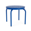 Front perspective view of a 20-inch round Sundance commercial aluminum outdoor side table featuring a vivid Marina blue powder-coated finish, four curved legs, and a top surface perforated with a random bubble pattern, isolated on a white background.