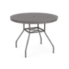 Perspective view of a 36-inch round Sundance commercial aluminum outdoor dining table in Titanium Gray powder coat, showcasing curved legs, umbrella cross-bracing, and an aluminum tabletop perforated with a uniform square "cube" grid pattern and center umbrella hole.