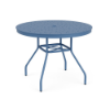 Perspective view of a 36-inch round Sundance commercial aluminum outdoor dining table in Steel Blue powder coat, featuring outward-curving legs, umbrella brace, and an aluminum tabletop with a decorative perforated "bubble" hole pattern surrounding a center umbrella opening.