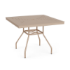 Three-quarter perspective view of a 36-inch square Sundance commercial aluminum dining table in Textured Antique Beige, highlighting a square top with a concentric slotted slat design, center umbrella hole, and curved legs.