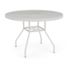 Three-quarter eye-level view of a 42-inch round Sundance commercial outdoor dining table with a Sky White powder-coated frame, curved aluminum legs, lower umbrella bracing, and a textured acrylic circular top with an umbrella ring.