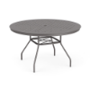 Three-quarter perspective view of a 48-inch round Sundance commercial aluminum outdoor dining table in Titanium Gray powder coat, showcasing splayed legs, an umbrella support cross-brace, and an aluminum top perforated with a uniform square cube grid pattern and center umbrella hole.