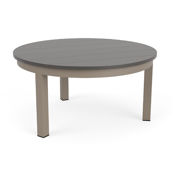 A round patio coffee table with a smooth grey slatted MGP tabletop and a satin amber beige aluminum frame with four straight legs