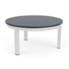 A round outdoor coffee table featuring a dark navy blue MGP slatted top set atop a sky white aluminum frame.