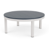 A round commercial outdoor coffee table with a dark navy blue slatted MGP top paired with a crisp Sky White aluminum frame.