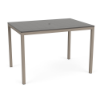 A 42" x 60" rectangular bar-height patio table featuring a neutral grey slatted MGP tabletop with a center umbrella hole, supported by a Satin Amber beige aluminum frame.