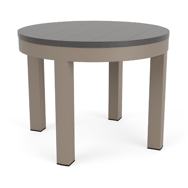 A 24-inch round outdoor side table featuring a smooth neutral grey MGP surface set in a warm beige-toned Satin Amber aluminum frame.