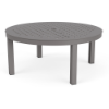 A 42-inch round outdoor aluminum coffee table in Titanium Gray featuring a uniform square grid cube pattern on the tabletop with a central umbrella opening.
