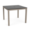 A 36-inch square commercial outdoor dining table featuring a dark slate grey panel-style Marine Grade Polymer (MGP) top with a center umbrella hole, mounted on a taupe powder-coated aluminum frame with four straight square legs and black glides.