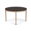 A 48-inch round commercial outdoor dining table featuring a dark slate grey slatted Marine Grade Polymer (MGP) top with a center umbrella hole, supported by a taupe powder-coated aluminum frame with four straight square legs and black glides.