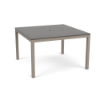 A 48-inch square commercial outdoor dining table featuring a mid-tone grey panel-style Marine Grade Polymer (MGP) top with a center umbrella hole, supported by a warm taupe/grey powder-coated aluminum frame with four straight square legs.