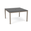 A 48-inch square commercial outdoor dining table featuring a dark slate grey panel-style Marine Grade Polymer (MGP) top with a center umbrella hole, supported by a taupe powder-coated aluminum frame with four straight square legs and black glides.