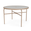 A 42-inch round commercial outdoor dining table with a textured clear acrylic top featuring a center umbrella hole, supported by a Textured Antique Beige powder-coated aluminum frame with tubular straight legs, cross-bracing, and black foot glides.