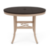 A round commercial-grade dining table featuring a Textured Antique Beige aluminum base, square cross-brace support ring, an umbrella hole, and a rich Northeastern Walnut wood-look MGP top.