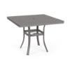 A 36-inch square commercial patio dining table with a Titanium Gray powder-coated aluminum frame, curved legs braced by a central umbrella ring, and a grid-perforated square cube top with an umbrella hole.