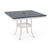 A 36-inch square commercial patio dining table with a Sky White powder-coated aluminum base, flared legs with an umbrella support brace, and a navy blue Marine Grade Polymer (MGP) slatted tabletop with a central umbrella hole.