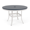 A 42-inch round commercial patio dining table with a Sky White powder-coated aluminum frame, flared legs with an umbrella cross-brace, and a navy blue Marine Grade Polymer (MGP) slatted tabletop with an umbrella opening in the center.