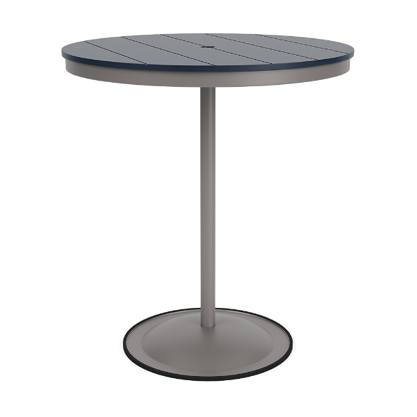 A 36-inch round commercial patio bar table built with a Platinum metallic powder-coated aluminum pedestal base and a circular weighted stand, featuring a navy blue Marine Grade Polymer (MGP) slatted surface with an umbrella hole.