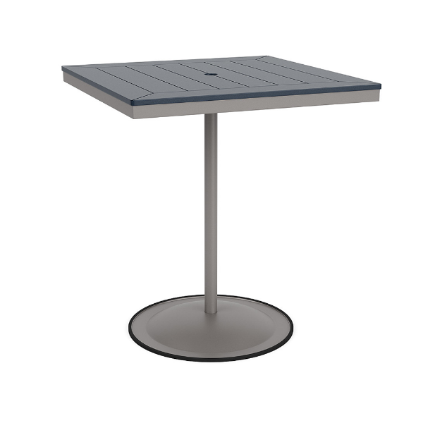 A 36-inch square commercial patio bar table built with a Platinum metallic powder-coated aluminum pedestal base and a circular weighted stand, featuring a navy blue Marine Grade Polymer (MGP) slatted surface with an umbrella hole.