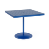 A 48-inch square commercial outdoor bar table featuring a Marina bright blue powder-coated aluminum pedestal post and round weighted footing, paired with a Royal Blue Marine Grade Polymer (MGP) slatted tabletop and a center umbrella opening.