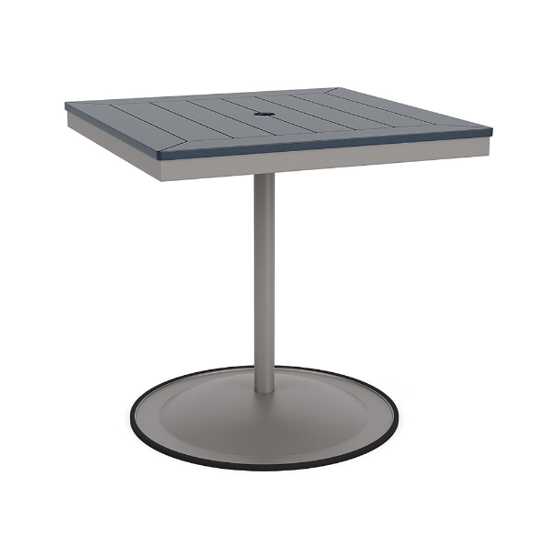 A 30-inch square commercial patio dining table built with a Platinum metallic powder-coated aluminum pedestal base and a circular weighted stand, featuring a navy blue Marine Grade Polymer (MGP) slatted surface with an umbrella hole.