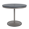 A 36-inch round commercial patio dining table built with a Platinum metallic powder-coated aluminum pedestal base and a circular weighted stand, featuring a navy blue Marine Grade Polymer (MGP) slatted surface with an umbrella hole.