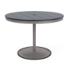 A 42-inch round commercial patio dining table built with a Platinum metallic powder-coated aluminum pedestal base and a circular weighted stand, featuring a navy blue Marine Grade Polymer (MGP) slatted surface with an umbrella hole.