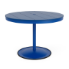 A 42-inch round commercial outdoor dining table featuring a Marina bright blue powder-coated aluminum pedestal post and round weighted footing, paired with a Royal Blue Marine Grade Polymer (MGP) slatted tabletop and a center umbrella opening.