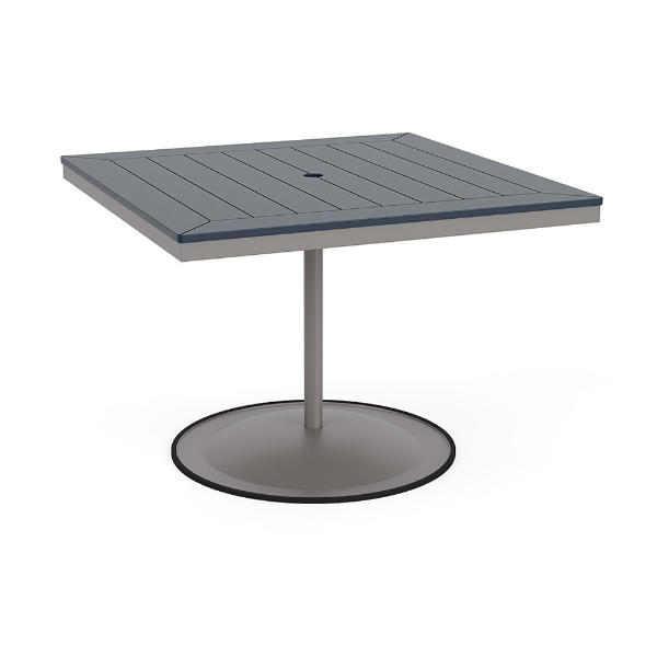 A 42-inch square commercial patio dining table built with a Platinum metallic powder-coated aluminum pedestal base and a circular weighted stand, featuring a navy blue Marine Grade Polymer (MGP) slatted surface with an umbrella hole.