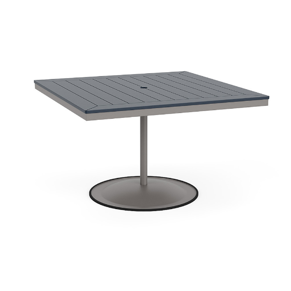 A 48-inch square commercial patio dining table built with a Platinum metallic powder-coated aluminum pedestal base and a circular weighted stand, featuring a navy blue Marine Grade Polymer (MGP) slatted surface with an umbrella hole.