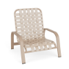 A commercial outdoor low-profile sand chair featuring a textured antique beige aluminum frame paired with matching off-white woven vinyl straps in a cross-weave pattern.